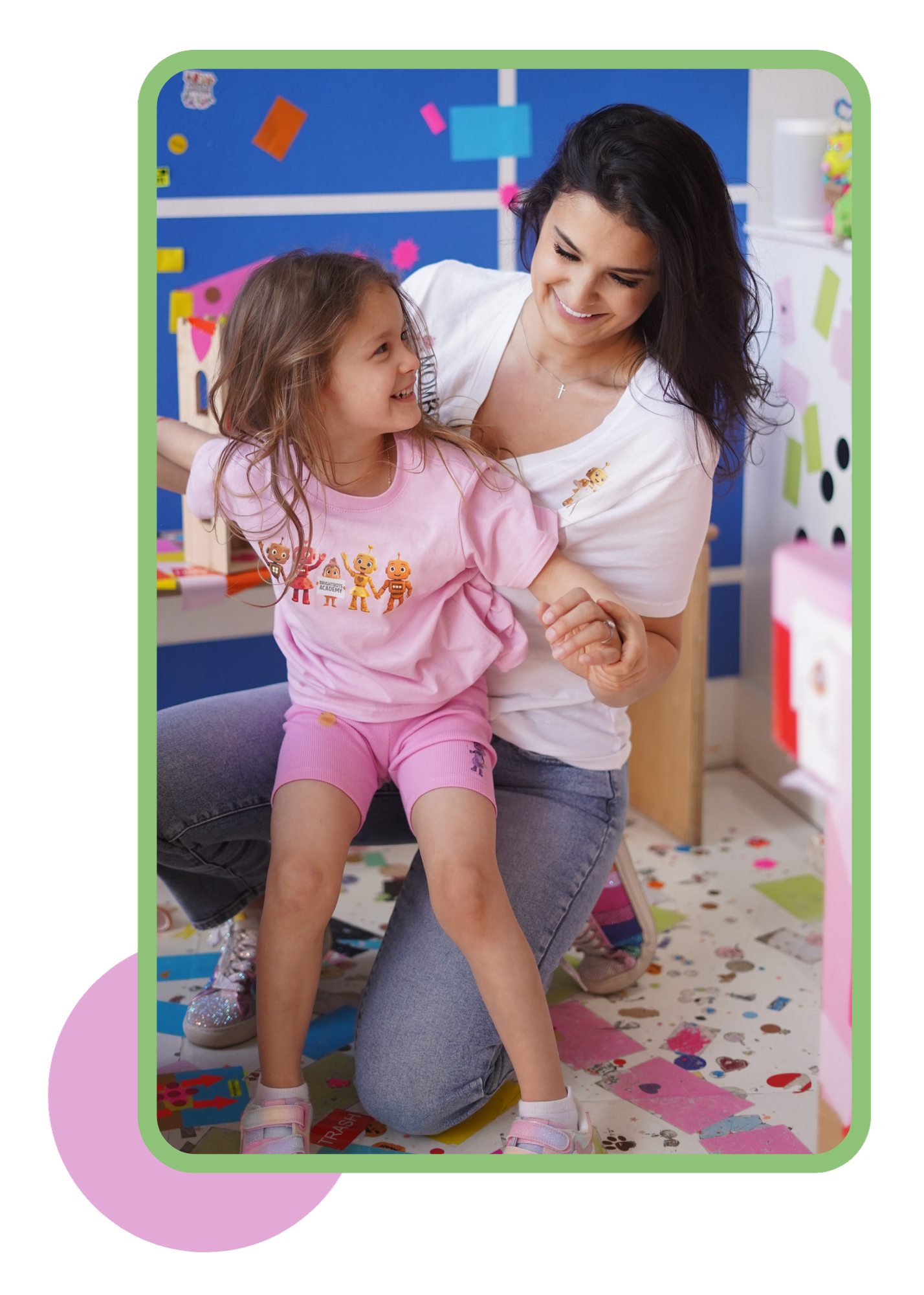 Mom and daughter playing together in a colorful classroom
